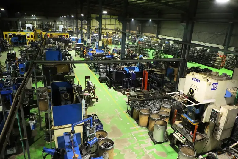 Aerial view down an aisle of the AR Automotive shop floor with presses and machines